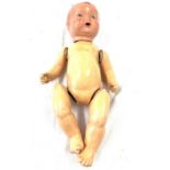 Vintage jointed doll, approximate length 16.5 inches