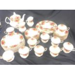 Royal Albert Old Country Rose 10 place setting tea service to include tea pot, milk jug, cake