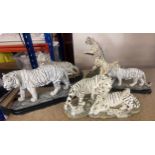 Selection of white tiger figurines