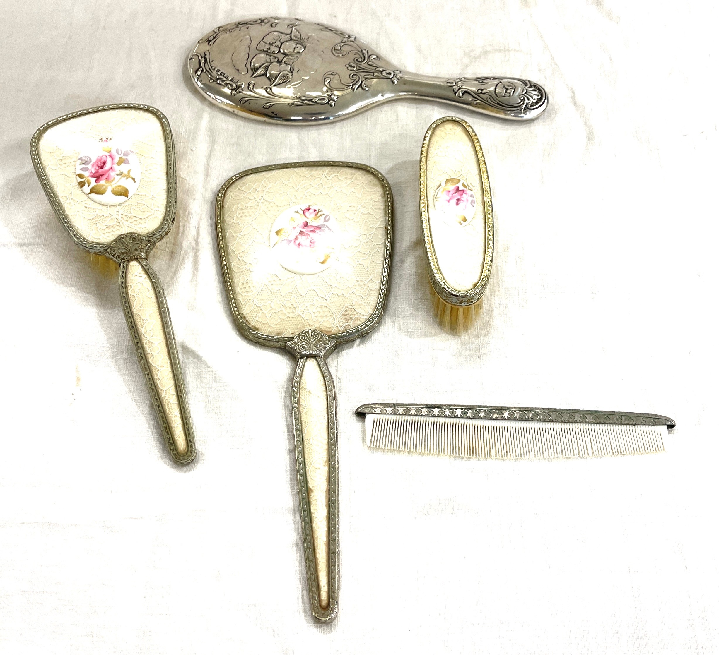 Silver hallmarked dressing table mirror, vintage dressing table set and singular comb