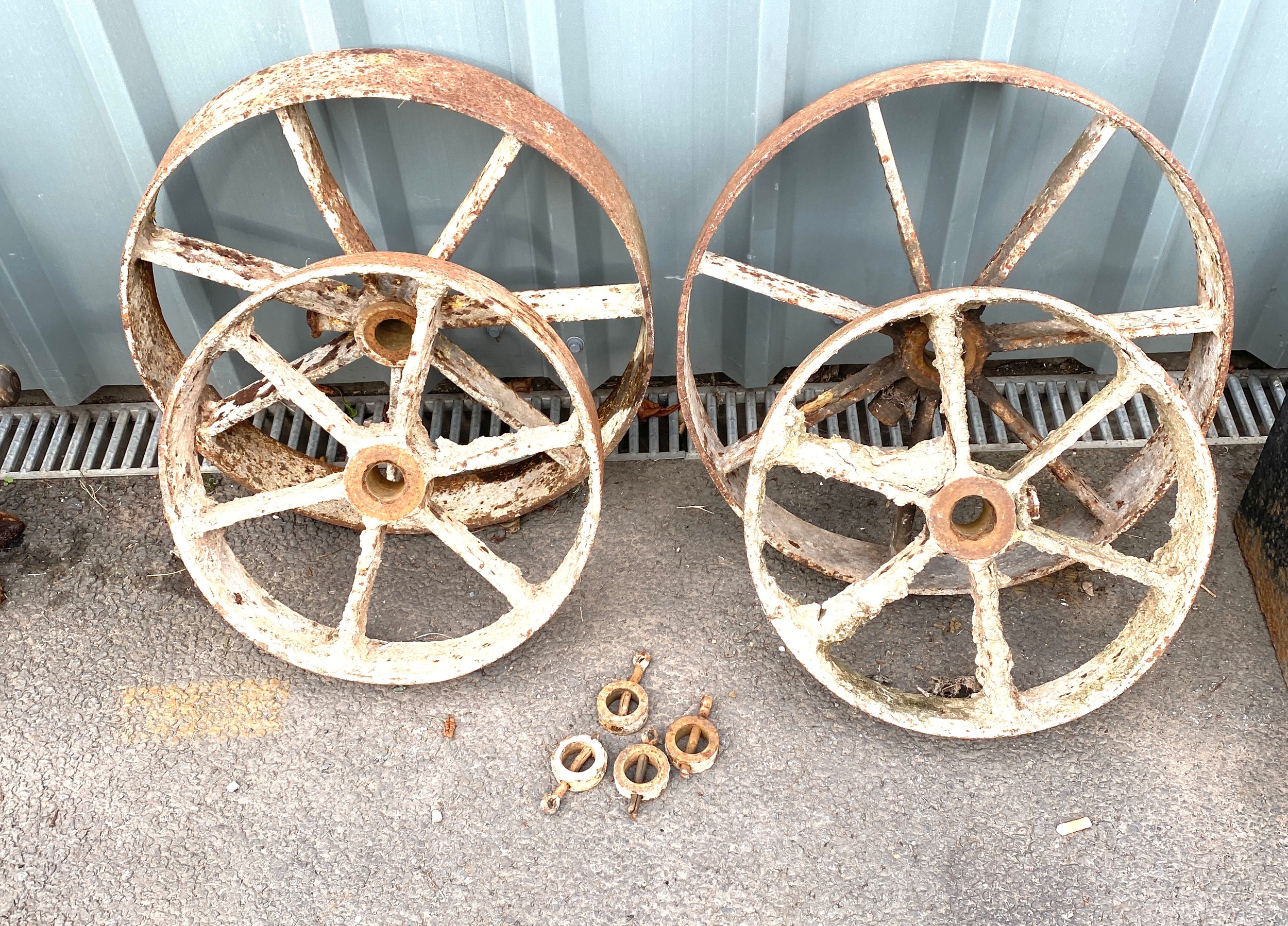 Four antique metal wheels measures approx diameter 20 inches