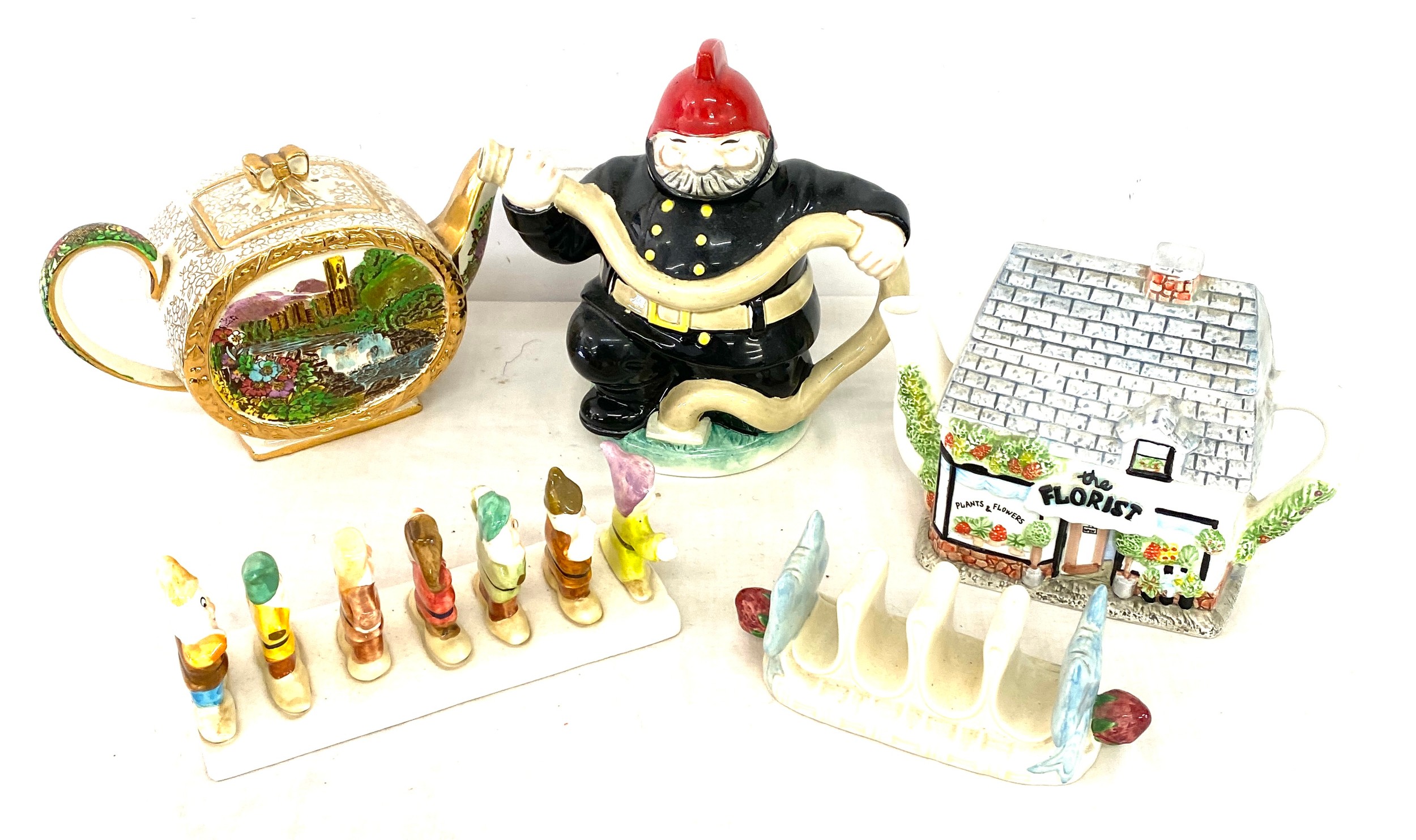 Selection of novelty teapots to include Sadler, Western house and J Luber, Walt Disney toast rack,