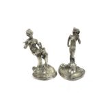 A pair of art Nouveau french white metal figures marked 95% etain and fleur de lis to base