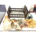 Selection of vintage and later dolls with a vintage cot includes Pedigree, black doll, vintage