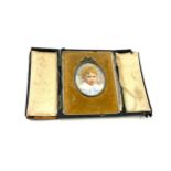 Original hand painted portrait miniature of a young boy in leather case
