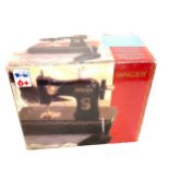 Vintage boxed childs singer sewing machine