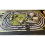 Table top model train layout with buildings and accessories, this measures approximately Length 72