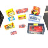 Large selection of boxed die cast cars includes Corgi, Maisto, Shell classic sports car etc