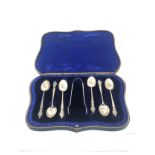 Boxed set of antique silver tea spoons & sugar tong