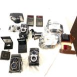 Large selection of assorted camera equipment includes Yashica 24 body parts, Paxetts 35mm camera etc