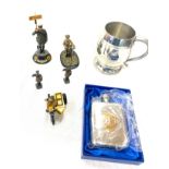 Selection of retro AA through the ages figurines, AA hip flask and a AA tanker