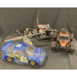 Selection of remote control vehicles to include racing car, buggy, helicopter etc one remote - all