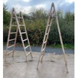 Pair of vintage wooden over sized ladders height approx 106 inches tall