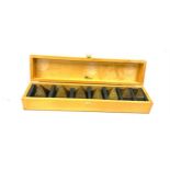 Cased set of Brass Pyramid paper weights