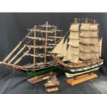 Two model Gallon ships one U.S.S constitution and a Cutty Sark plus one other tallest measures 17.