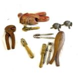 Large selection of novelty nut crackers include carved wooden, brass etc