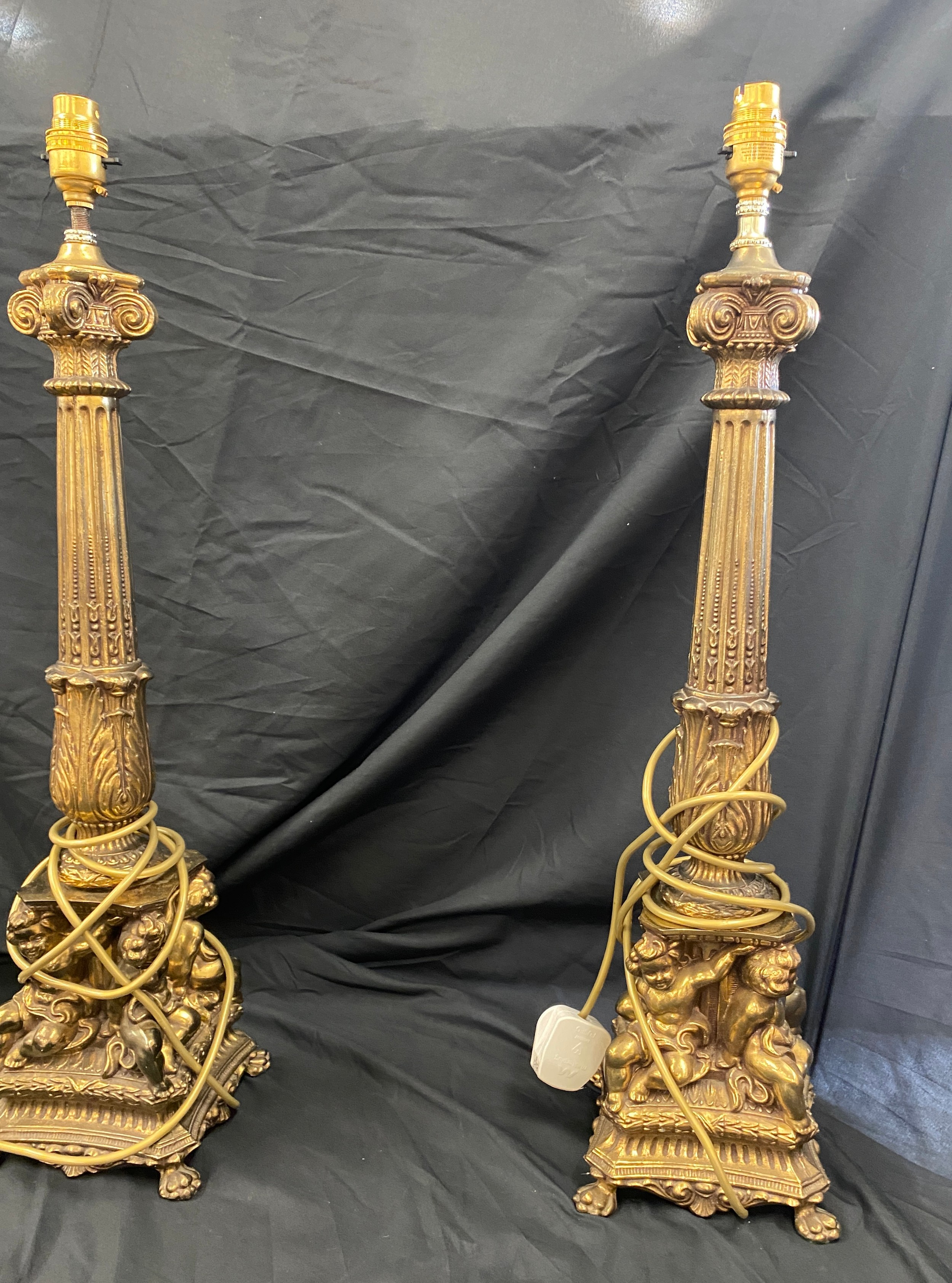 Pair of ornate brass candle sticks, total height 25 inches