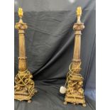 Pair of ornate brass candle sticks, total height 25 inches