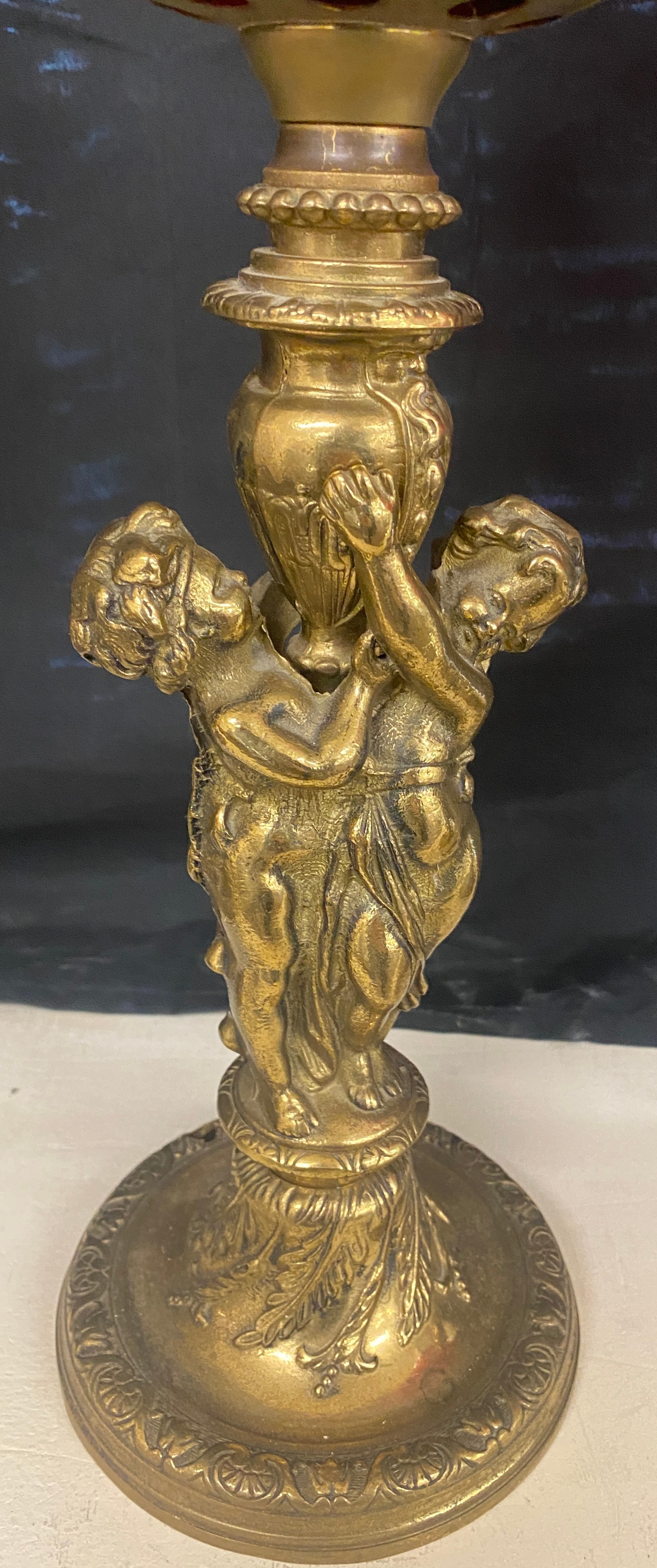 Brass oil lamp, cranberry shade and font with cherubs, approximate height 28 inches - Image 2 of 3