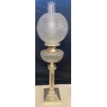 Antique silver plated Nelson column oil lamp, glass shade and font, approximate height 27 inches