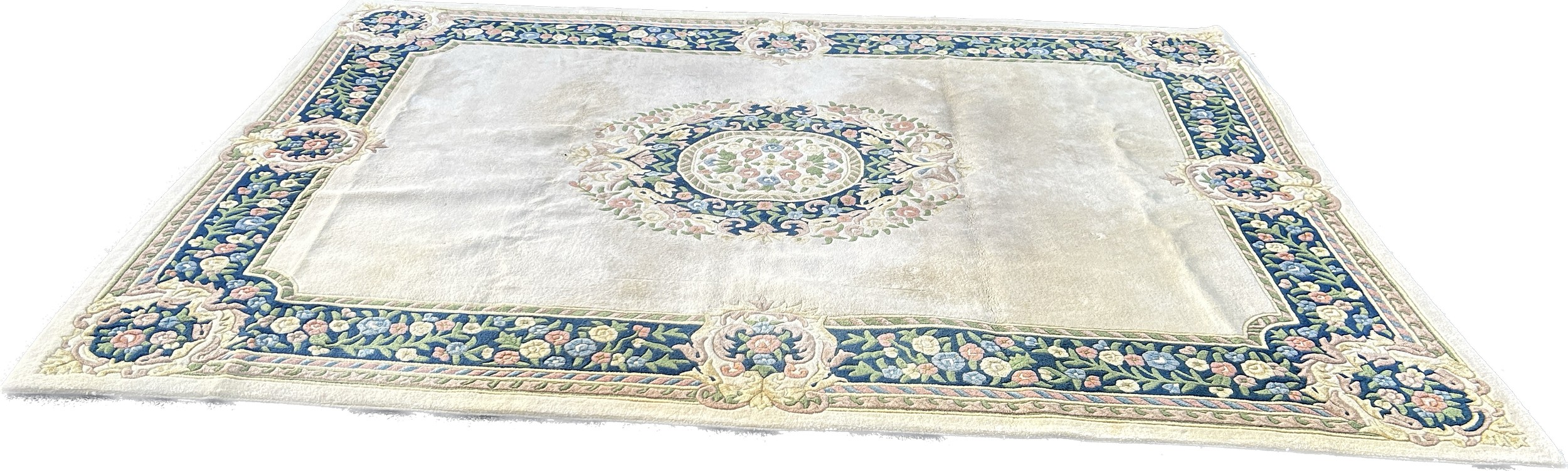 Large cream coloured patterned lounge rug, approximate measurements: 143 x 107 inches