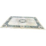 Large cream coloured patterned lounge rug, approximate measurements: 143 x 107 inches