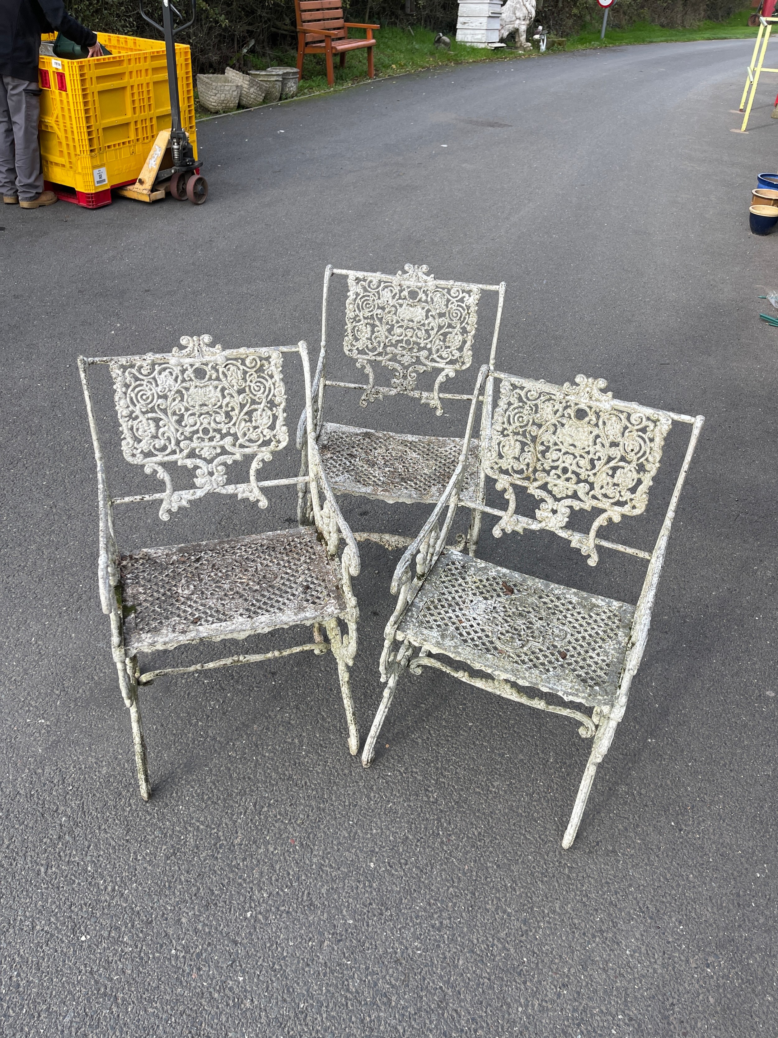 Three vintage iron garden chairs