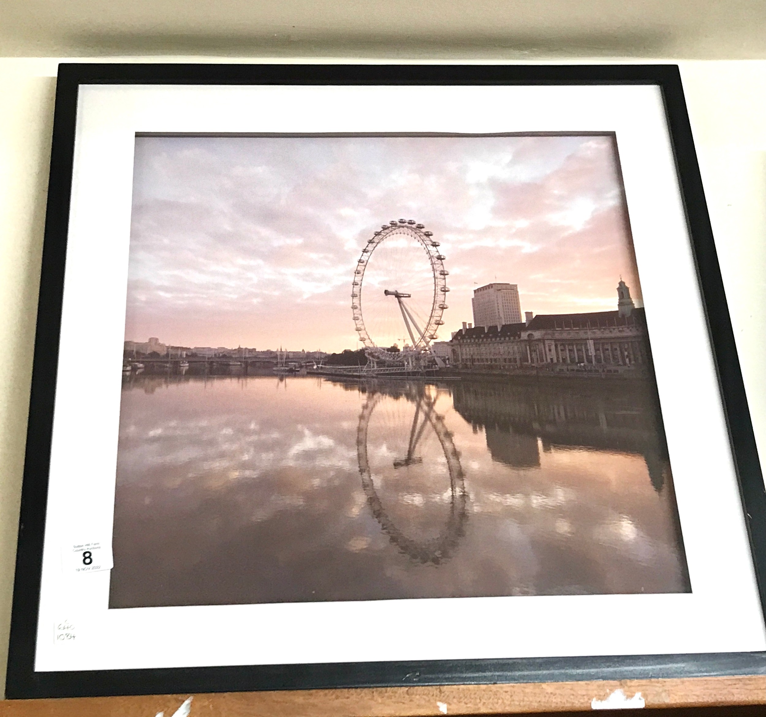 Framed London eye print measures approx 23 inches by 23.5 inches
