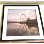 Framed London eye print measures approx 23 inches by 23.5 inches