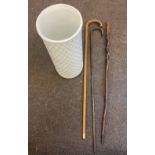 3 Vintage wooden walking sticks together with porcelain umbrella stand