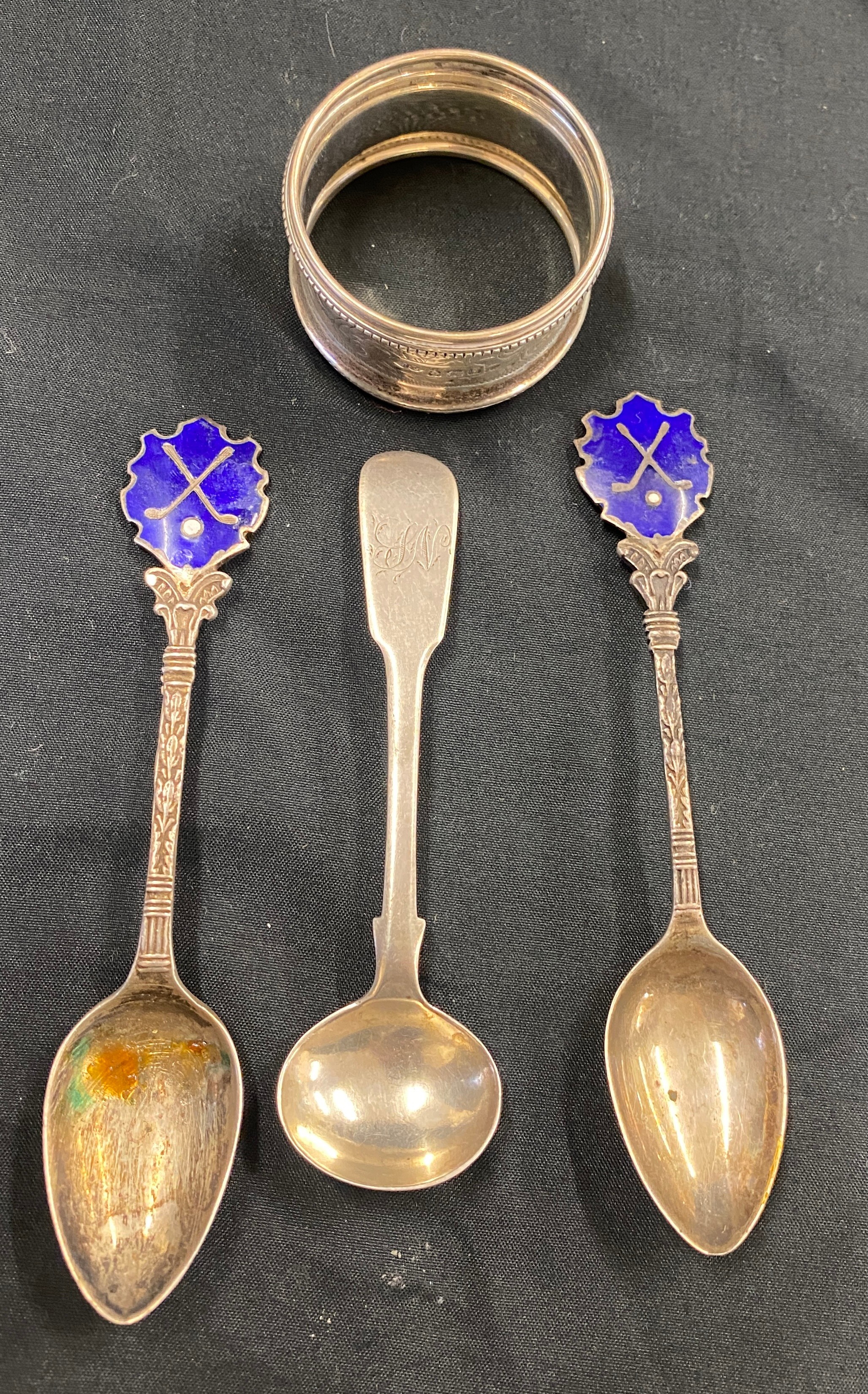 3 silver and enamel spoons and a silver napkin ring