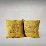 Banksy (British 1974-), 'Cushions', 2019, a pair of Gross Domestic Product Cushions, unique hand-