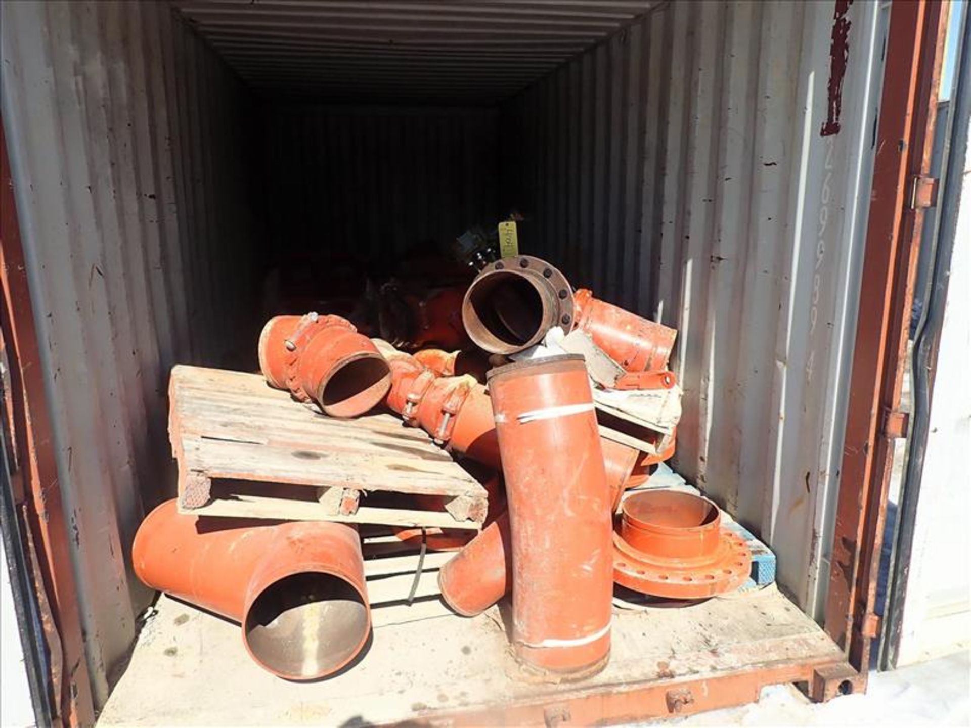 20 ft. Shipping Container w/ contents, incl: misc. 12 in. Victaulic pipe fittings, flanges, etc. (