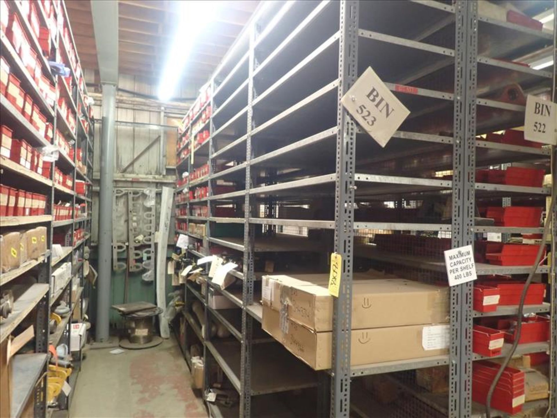 contents of shelving: cylinders, bushings, washers, spare parts, etc. (Bin 523)