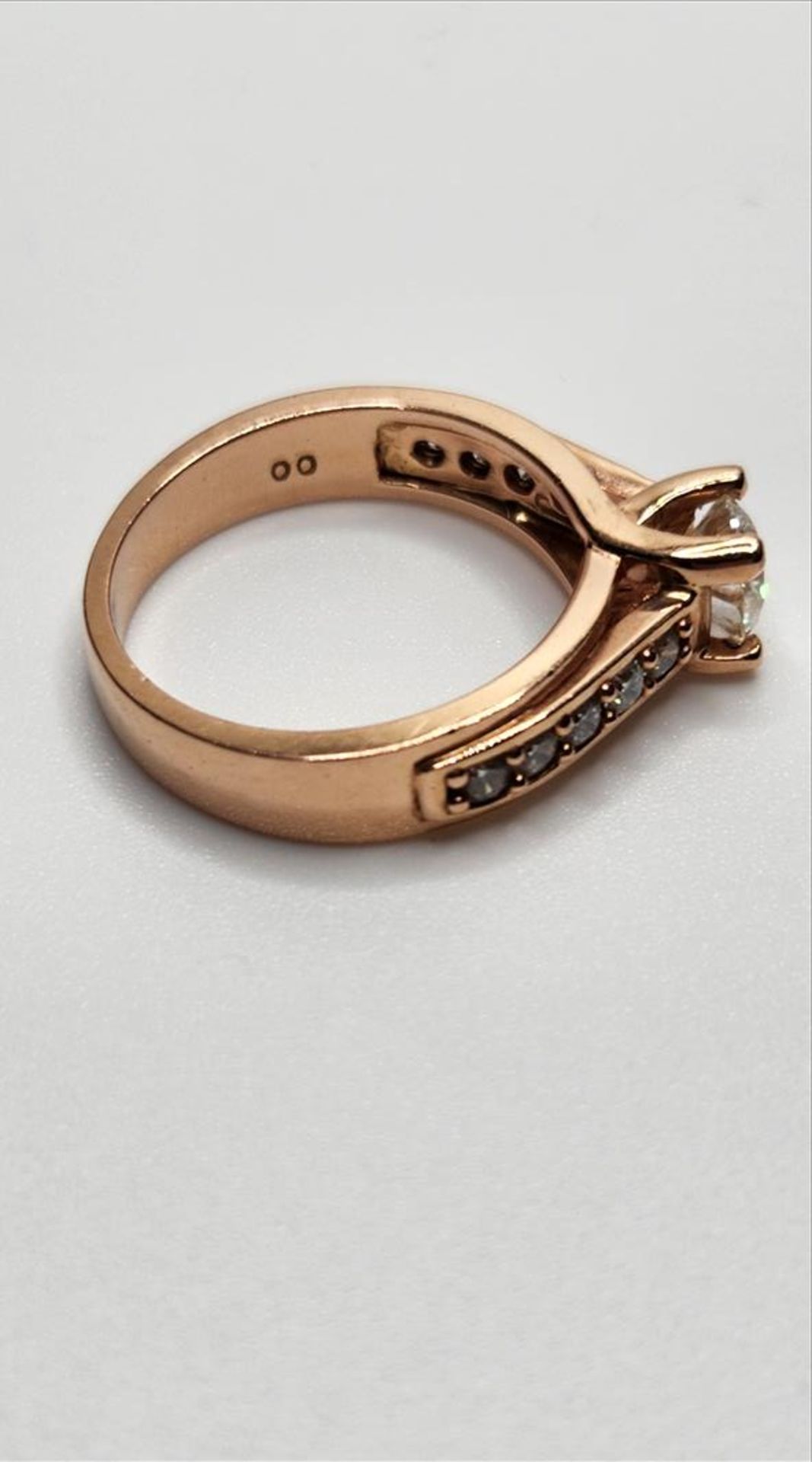 One lady’s stamped and tested 14kt pink gold diamond engagement ring. Contained at the centre is one - Image 3 of 7