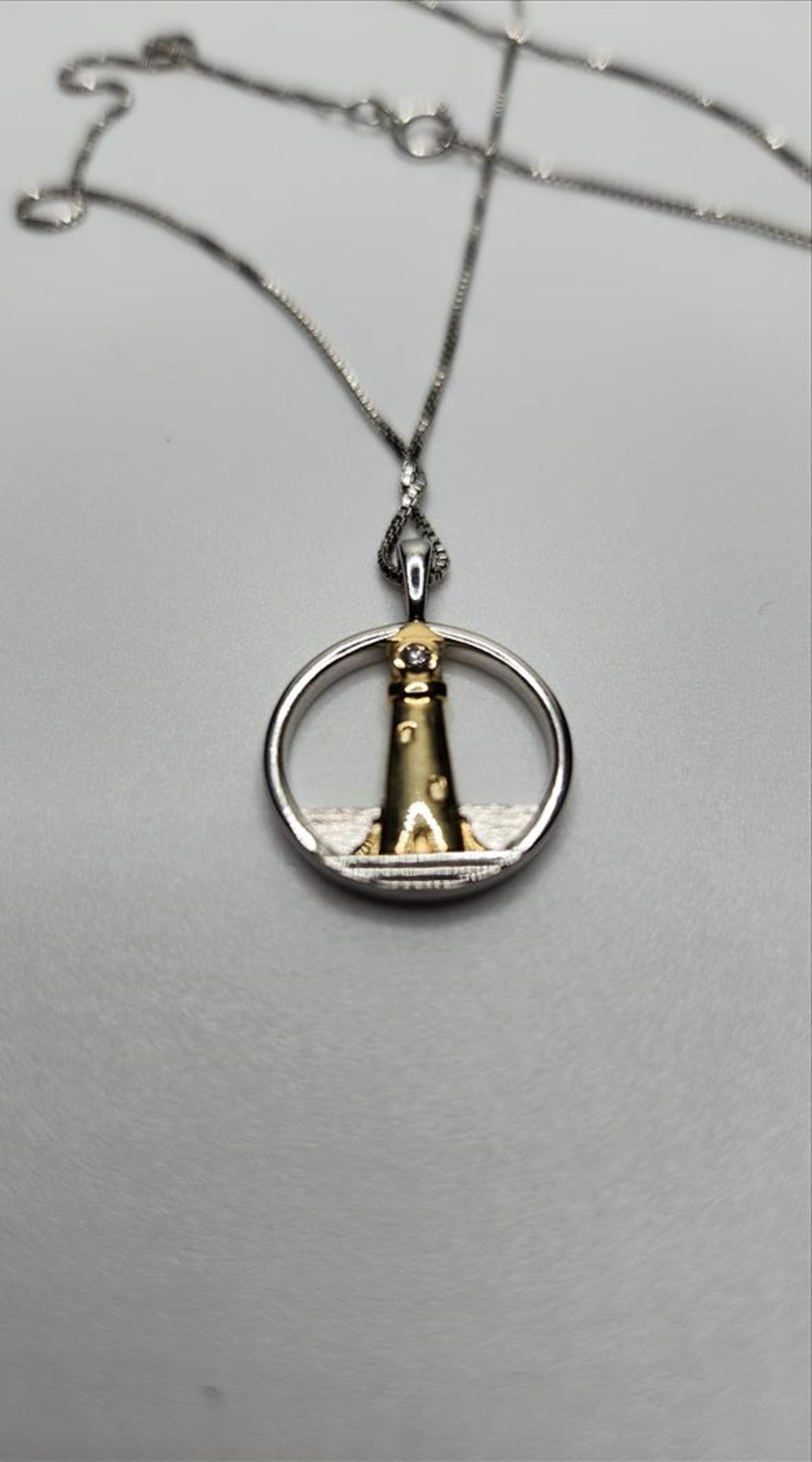 One lady’s stamped and tested 10kt yellow gold and sterling silver Diamond Lighthouse pendant - Image 6 of 8