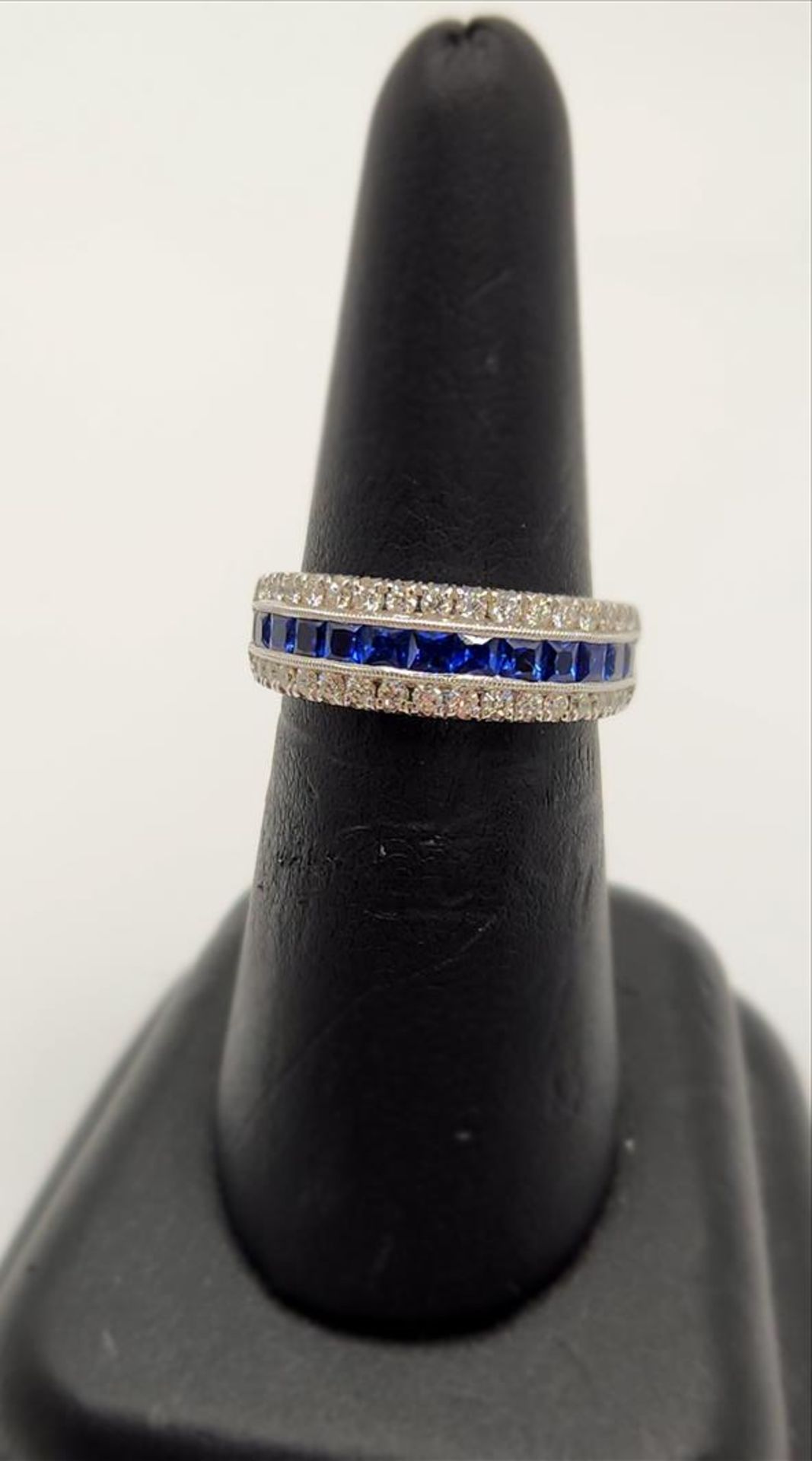 One lady’s stamped and tested 14kt white gold (Zeghani) sapphire and diamond band. Channel set - Image 2 of 4