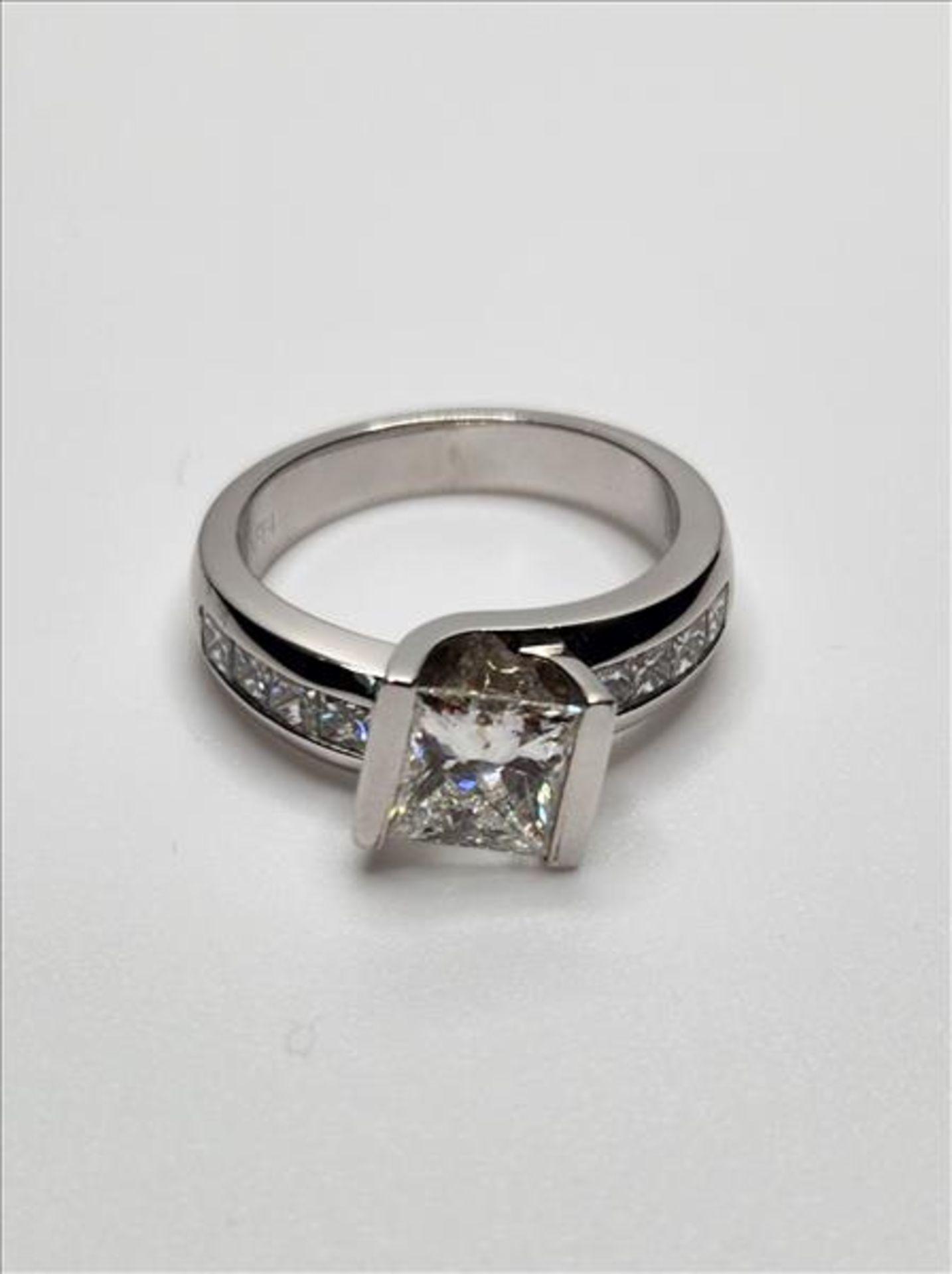 One lady’s stamped RAFP4 and tested 14kt white gold diamond ring by Michael Hill. Contained at the