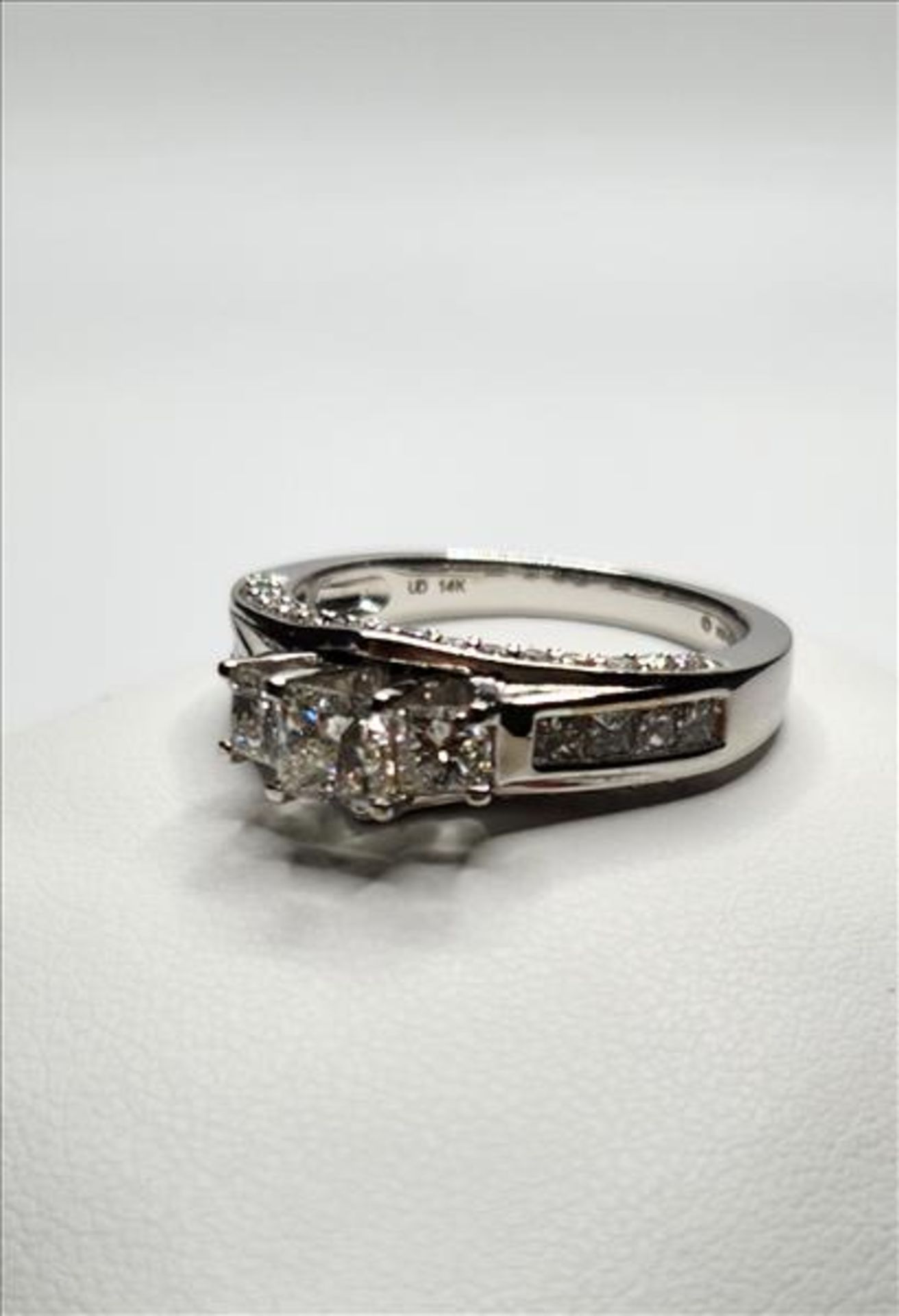 One lady’s stamped and tested 14kt white gold Arctic Brilliance trademark Canadian Diamond ring (