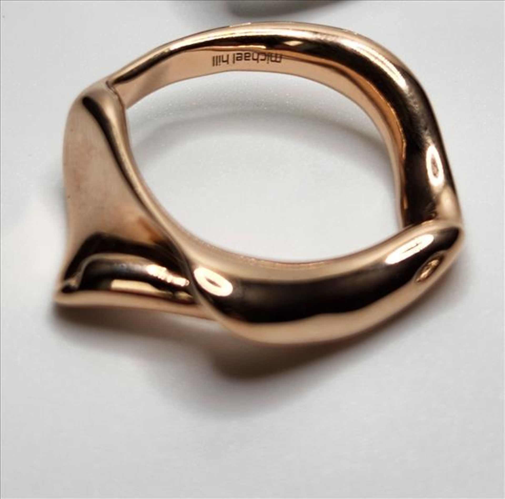 One lady’s stamped Michael Hill and tested 10kt pink gold “Spirits Bay” ring. This ring consists