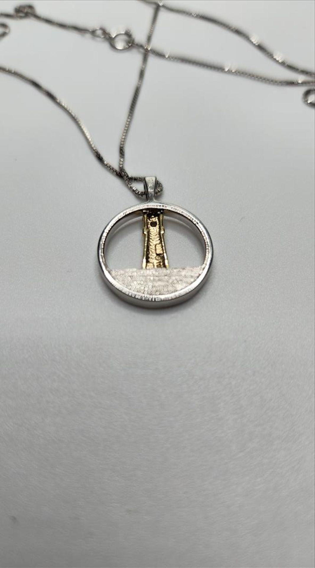 One lady’s stamped and tested 10kt yellow gold and sterling silver Diamond Lighthouse pendant - Image 5 of 8