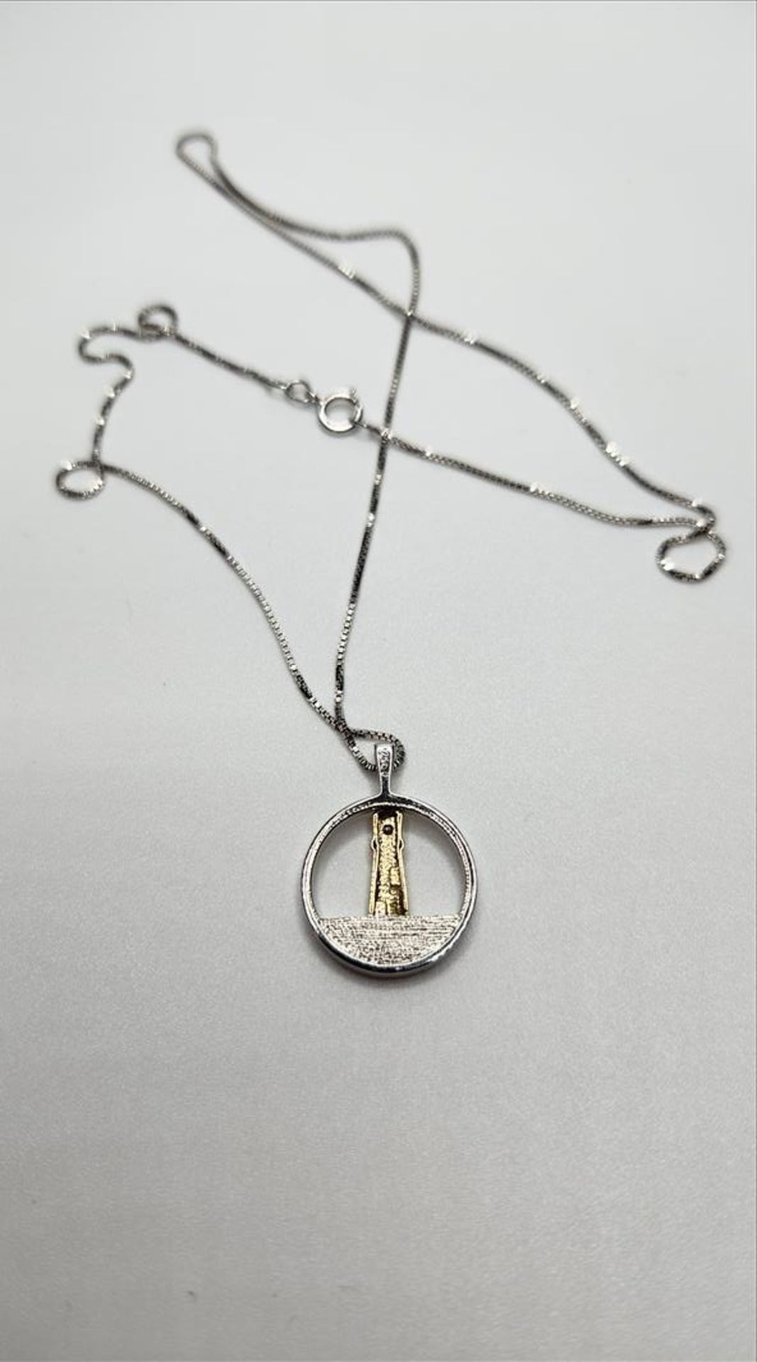 One lady’s stamped and tested 10kt yellow gold and sterling silver Diamond Lighthouse pendant - Image 4 of 8