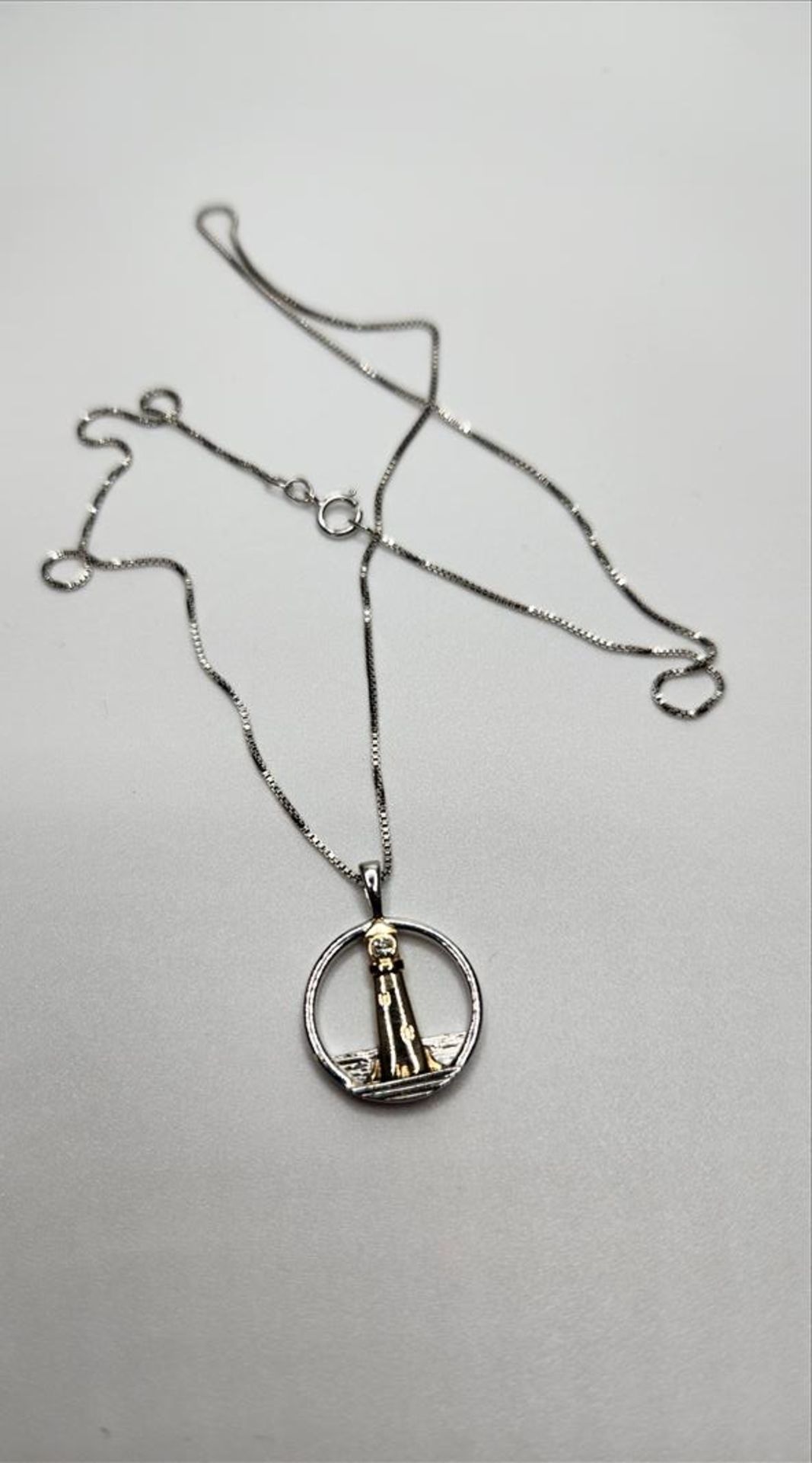 One lady’s stamped and tested 10kt yellow gold and sterling silver Diamond Lighthouse pendant - Image 3 of 8