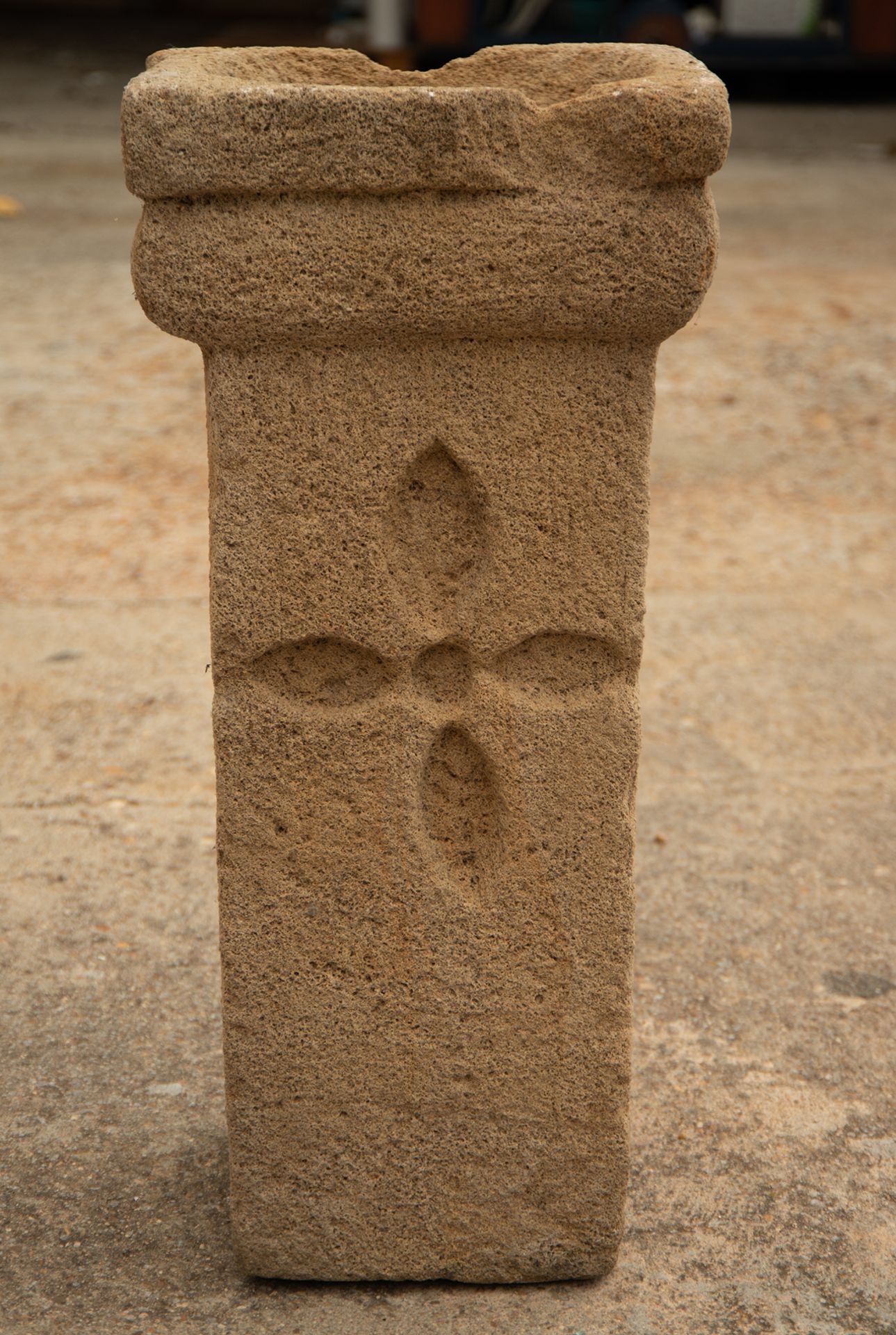 Romanesque font with a carved cross central motif, possibly 13th century