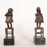 Pair of bronzes of Girls climbing on a chair, French school of the end of the 19th century