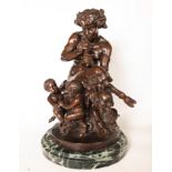 Faun in Bronze playing the flute with two Cherubs, possibly an Italian school from the second half o
