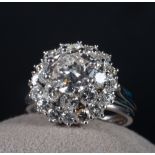 Important Ring with 2 Carat central Diamond mounted in white gold