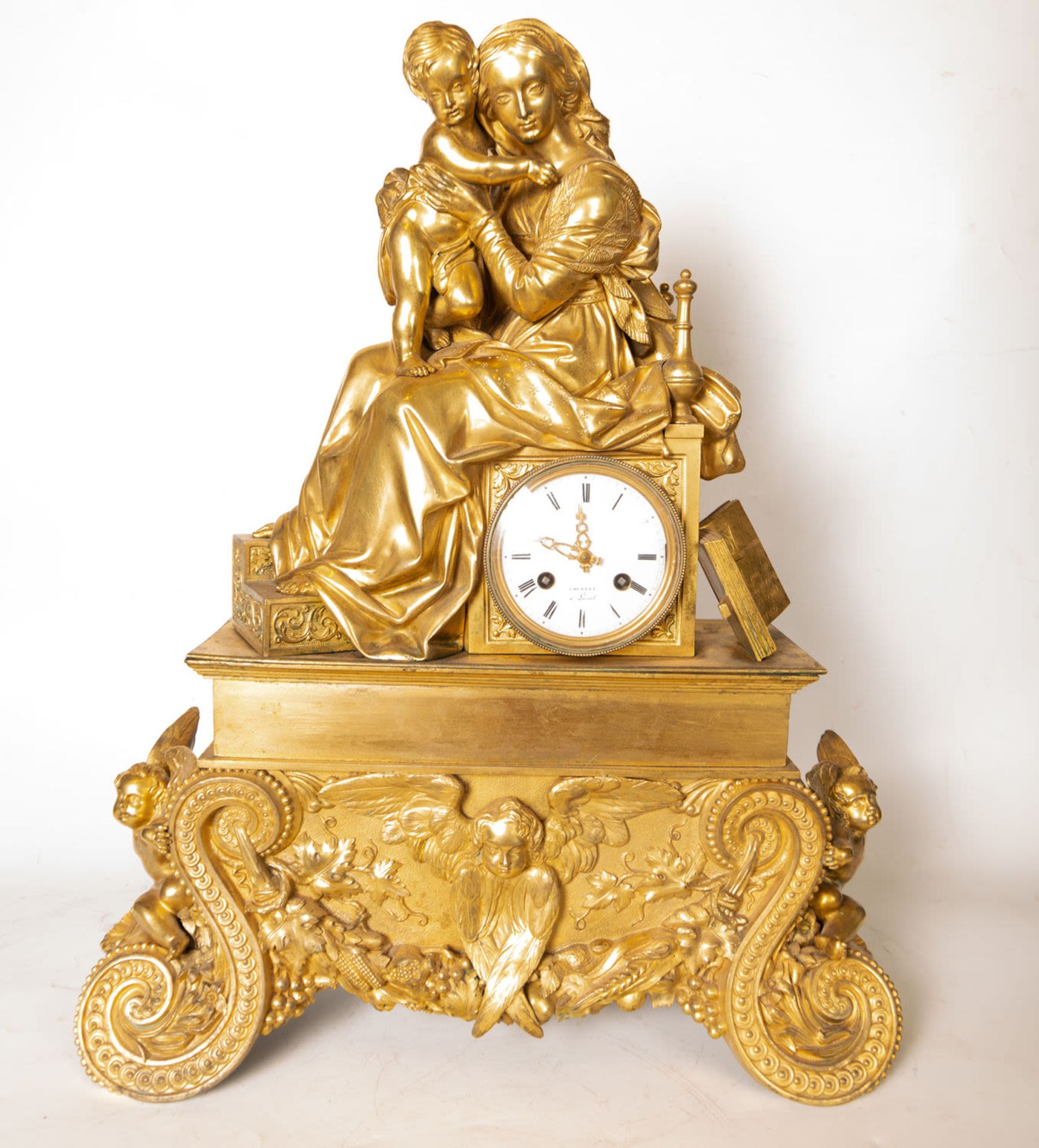 Clock in gilt bronze, with motif of Virgin with Child, French school of the 19th century, Charles X 