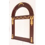 Arch-shaped Empire style mirror in mahogany and gilt bronze appliqués, late 19th century French scho