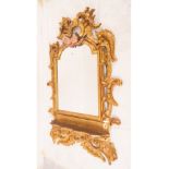 Rococo style mirror in gilt wood with Corbel and topped by a pair of Angelotes, Italian school of th